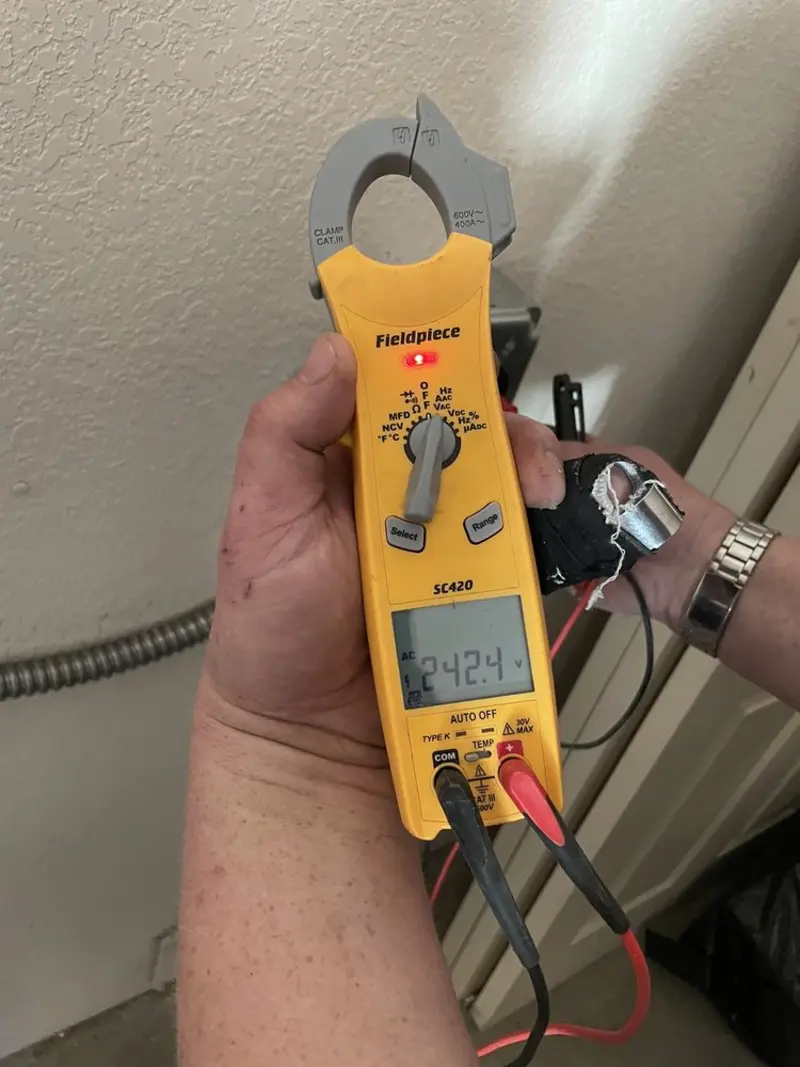 Voltage testing with clamp meter during Recessed Lighting Installation in Freeport